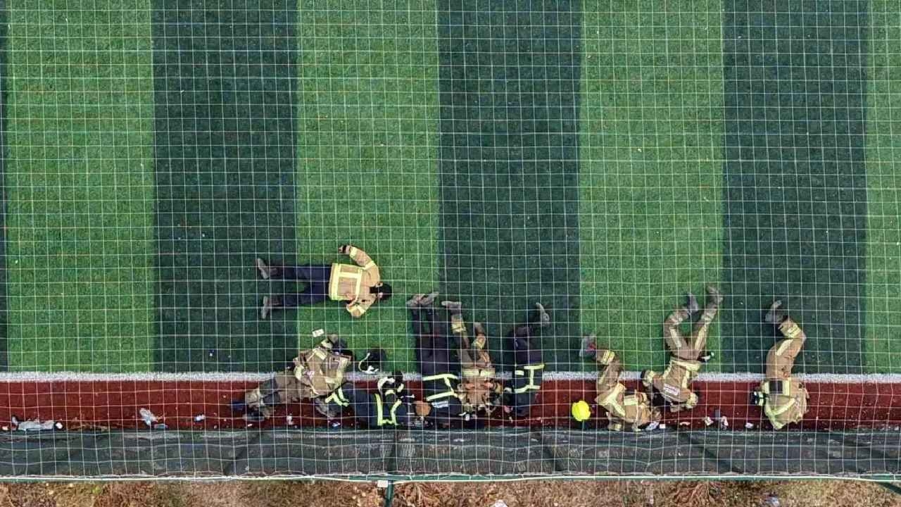 Firefighters battling the flames rested on the astroturf pitch