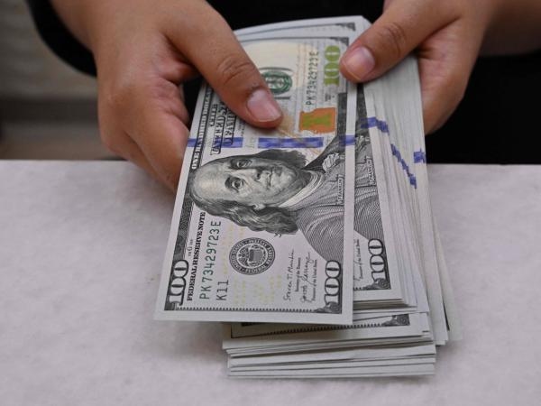 The dollar closed lower on Tuesday in anticipation of first-half results.